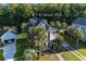 Beautiful green two-story home with a manicured lawn and charming curb appeal at 136 Heart Pine Cir, Summerville, SC 29485