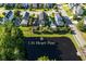 The green home is nestled beside a tranquil pond in the quiet neighborhood at 136 Heart Pine Cir, Summerville, SC 29485