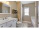 Bright bathroom featuring a double vanity, tile floors, and separate tub and shower at 136 Heart Pine Cir, Summerville, SC 29485