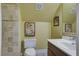Bathroom featuring tiled walls, a modern toilet, and a stylish vanity with clean white sink at 136 Heart Pine Cir, Summerville, SC 29485