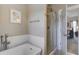 Beautiful bathroom featuring a soaking tub, glass shower and an open doorway at 136 Heart Pine Cir, Summerville, SC 29485
