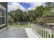 Expansive deck offering serene views of lush landscaping, a pond, and a shaded gazebo at 136 Heart Pine Cir, Summerville, SC 29485