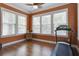 Bright exercise room featuring hardwood floors, many windows and a ceiling fan at 136 Heart Pine Cir, Summerville, SC 29485