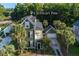 Aerial view of a two-story green home with a garage and landscaped yard at 136 Heart Pine Cir, Summerville, SC 29485