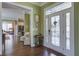 Elegant foyer featuring hardwood floors, a decorative door, and a view into the living spaces at 136 Heart Pine Cir, Summerville, SC 29485