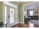 Welcoming foyer with decorative glass doors and a view into the living room at 136 Heart Pine Cir, Summerville, SC 29485
