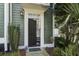 Welcoming front entrance with a dark-colored front door, sidelight, and a well-manicured garden at 136 Heart Pine Cir, Summerville, SC 29485