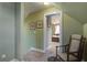 Upstairs hallway featuring green walls with a view to the primary bedroom at 136 Heart Pine Cir, Summerville, SC 29485