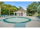Relaxing hot tub provides a perfect oasis with lounge chairs, umbrellas, and lots of trees at 136 Heart Pine Cir, Summerville, SC 29485