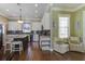 Modern kitchen features granite countertops, an island with seating, and stainless steel appliances for a stylish and functional space at 136 Heart Pine Cir, Summerville, SC 29485