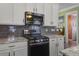 A chef's kitchen with stainless steel appliances, granite countertops, and gas range for cooking gourmet meals at 136 Heart Pine Cir, Summerville, SC 29485