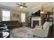 Cozy living room with a fireplace, comfortable seating, and plenty of natural light at 136 Heart Pine Cir, Summerville, SC 29485