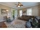 Bright living room featuring a sectional sofa, decorative rug, and an open layout at 136 Heart Pine Cir, Summerville, SC 29485
