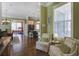 Bright and airy living room with hardwood floors and view of the kitchen and dining area, offering a comfortable living space at 136 Heart Pine Cir, Summerville, SC 29485