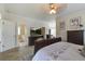Open concept main bedroom with large flat screen television and attached bathroom at 136 Heart Pine Cir, Summerville, SC 29485