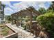 Outdoor patio with pergola, comfortable seating, lush landscaping, and serene views of the greenery at 136 Heart Pine Cir, Summerville, SC 29485