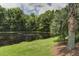 Picturesque view of a tranquil pond surrounded by trees and lush greenery at 136 Heart Pine Cir, Summerville, SC 29485