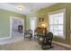Sitting Room with bright green walls, fireplace in adjacent room and carpeted floor at 136 Heart Pine Cir, Summerville, SC 29485