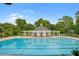 Inviting swimming pool with a charming pavilion and plenty of seating for relaxation at 136 Heart Pine Cir, Summerville, SC 29485