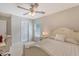 Cozy bedroom with plush carpet, ceiling fan and natural light from a window with blinds at 139 Gaslight Blvd, Summerville, SC 29483