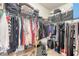 Walk-in closet with metal organizers and shelves containing clothes, shoes, bags, and other personal belongings at 139 Gaslight Blvd, Summerville, SC 29483
