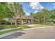 Community pool house surrounded by palm trees on a sunny day at 139 Gaslight Blvd, Summerville, SC 29483