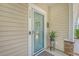 Inviting front entrance with a glass storm door, decorative wreath, and house number at 139 Gaslight Blvd, Summerville, SC 29483