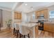 Modern kitchen with stainless steel appliances, white countertops, and a breakfast bar with seating at 139 Gaslight Blvd, Summerville, SC 29483