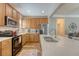This is a great kitchen with a nice stainless steel refrigerator and wooden cabinets and an island with an oversized sink at 139 Gaslight Blvd, Summerville, SC 29483