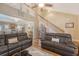 Bright living room featuring hardwood floors, staircase, and comfortable sofas, and a ceiling fan at 139 Gaslight Blvd, Summerville, SC 29483