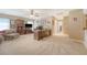 Expansive living space with plush carpeting, neutral tones, wooden furniture, and cozy seating areas at 139 Gaslight Blvd, Summerville, SC 29483