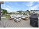Spacious deck features a large sofa, fire pit, and grill, perfect for entertaining with views of the neighborhood at 1464 Stratton Pl, Mount Pleasant, SC 29466