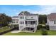 Back exterior of the home features a patio space and fenced-in yard with trees at 1464 Stratton Pl, Mount Pleasant, SC 29466