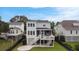Back exterior of the home showing a covered patio space and a fenced-in yard at 1464 Stratton Pl, Mount Pleasant, SC 29466