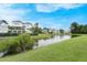 Backyard pond of the home is surrounded by lush greenery and other neighboring houses at 1464 Stratton Pl, Mount Pleasant, SC 29466