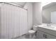 Bright bathroom featuring a white vanity, framed mirror, and shower with a patterned shower curtain at 1464 Stratton Pl, Mount Pleasant, SC 29466