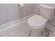 Powder room with tiled floor and a standard white toilet at 1464 Stratton Pl, Mount Pleasant, SC 29466