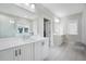 The spacious bathroom features a double vanity, large mirrors and plenty of storage space at 1464 Stratton Pl, Mount Pleasant, SC 29466