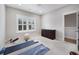 The bedroom has space for exercise and is decorated with a dark wood dresser at 1464 Stratton Pl, Mount Pleasant, SC 29466