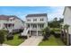Two-story home with a manicured lawn and a lovely front porch at 1464 Stratton Pl, Mount Pleasant, SC 29466