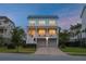 Charming two-story home with a well-manicured lawn and a welcoming front porch at 1464 Stratton Pl, Mount Pleasant, SC 29466