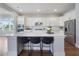 Beautiful kitchen features a large island, stainless steel appliances, and elegant white cabinetry at 1464 Stratton Pl, Mount Pleasant, SC 29466