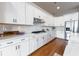 Well-lit kitchen featuring stainless steel appliances, white cabinets, and ample counter space at 1464 Stratton Pl, Mount Pleasant, SC 29466