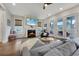 Inviting living room boasts a cozy fireplace, TV, and access to outdoor patio with comfortable seating at 1464 Stratton Pl, Mount Pleasant, SC 29466