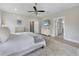 Bright main bedroom featuring a ceiling fan, a dresser and an ensuite bathroom at 1464 Stratton Pl, Mount Pleasant, SC 29466