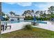 Inviting pool with clubhouse, tables, chairs, and mature trees surrounding the area at 1464 Stratton Pl, Mount Pleasant, SC 29466