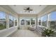 This sunroom is filled with natural light from its many windows overlooking the yard at 1464 Stratton Pl, Mount Pleasant, SC 29466