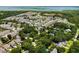 Expansive aerial view showcases a vibrant community with waterfront homes, lush greenery, and scenic coastal views at 1515 N Lakeshore Dr, Mount Pleasant, SC 29466