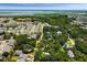 Aerial view of a community with lush green trees and waterways, showcasing a peaceful residential environment at 1515 N Lakeshore Dr, Mount Pleasant, SC 29466