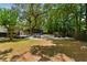 Lush backyard featuring a spacious patio with outdoor seating and a charming outbuilding at 1515 N Lakeshore Dr, Mount Pleasant, SC 29466